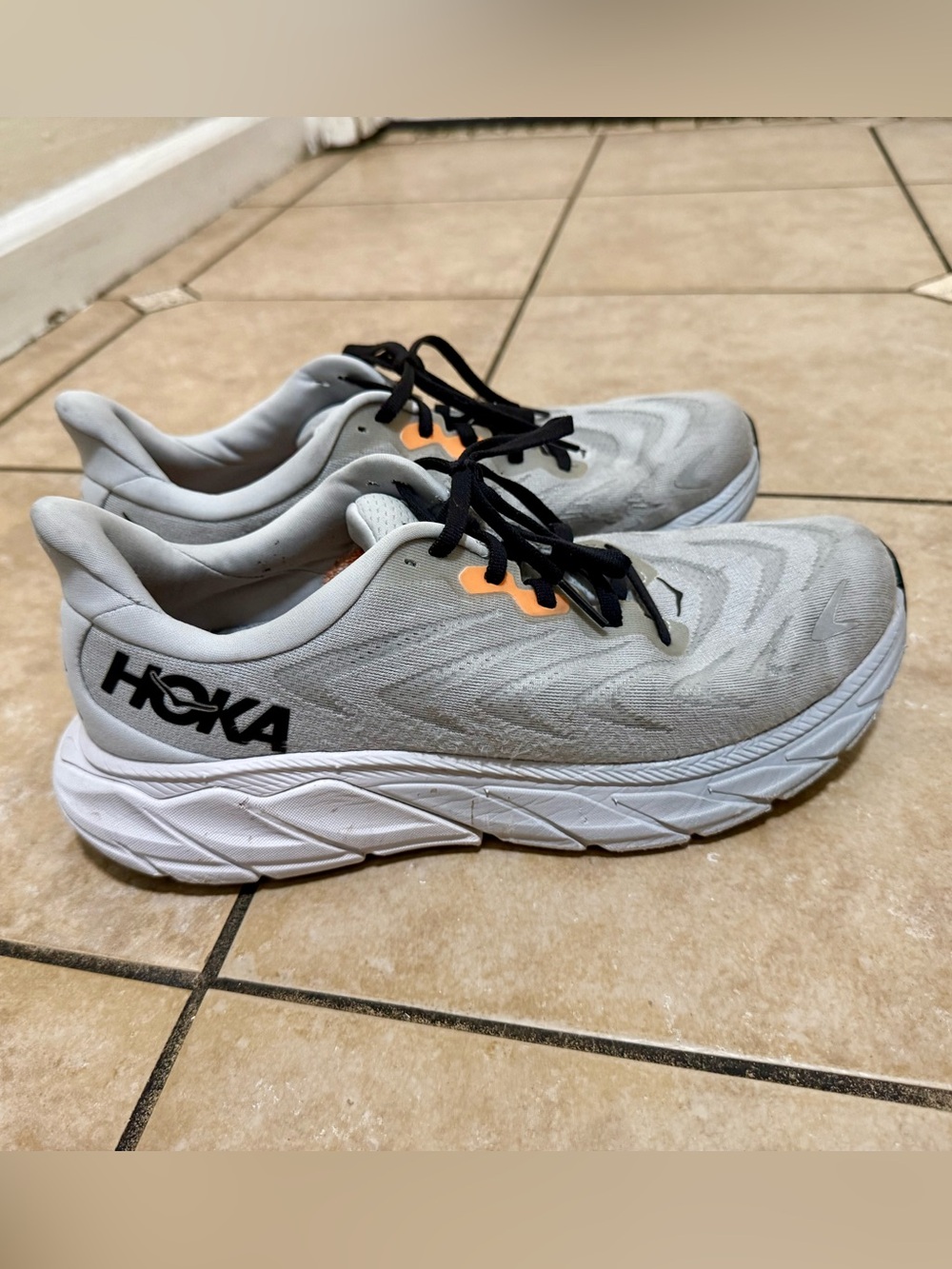 Hoka Men's Running Sneakers in Light Gray with Black and Orange Accents